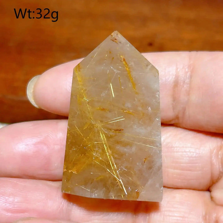 Hand-polished Golden Rutilated Quartz tower with fine golden needles, perfect for focus and energy amplification.