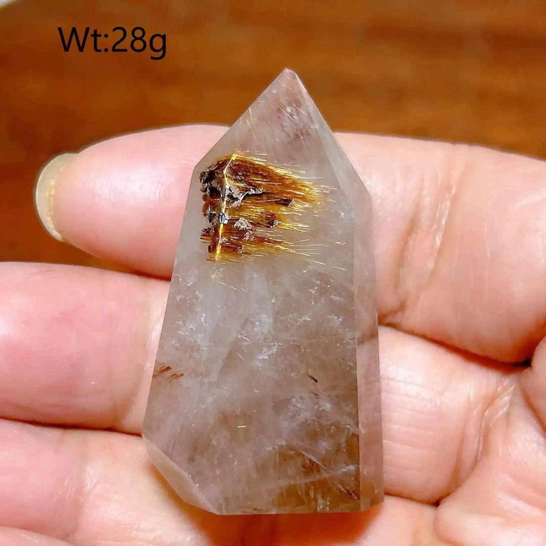 Hand-polished Golden Rutilated Quartz tower with fine golden needles, perfect for focus and energy amplification.