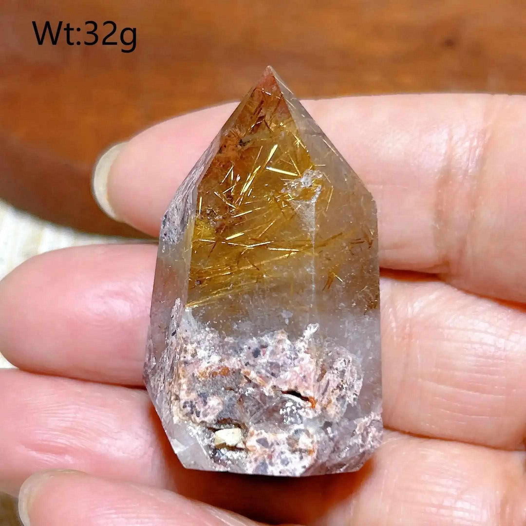Hand-polished Golden Rutilated Quartz tower with golden needles, perfect for amplifying energy and focus in your space.