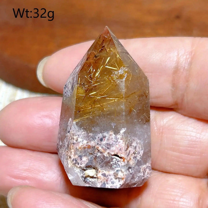 Hand-polished Golden Rutilated Quartz tower with golden needles, perfect for amplifying energy and focus in your space.