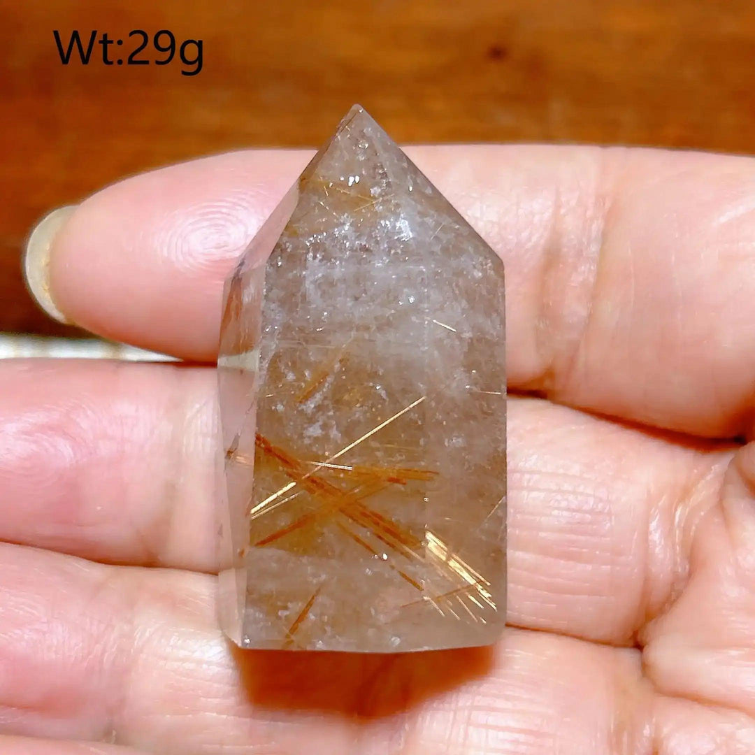 Hand-polished Golden Rutilated Quartz tower with clear crystal and fine golden rutile needles for amplified energy.