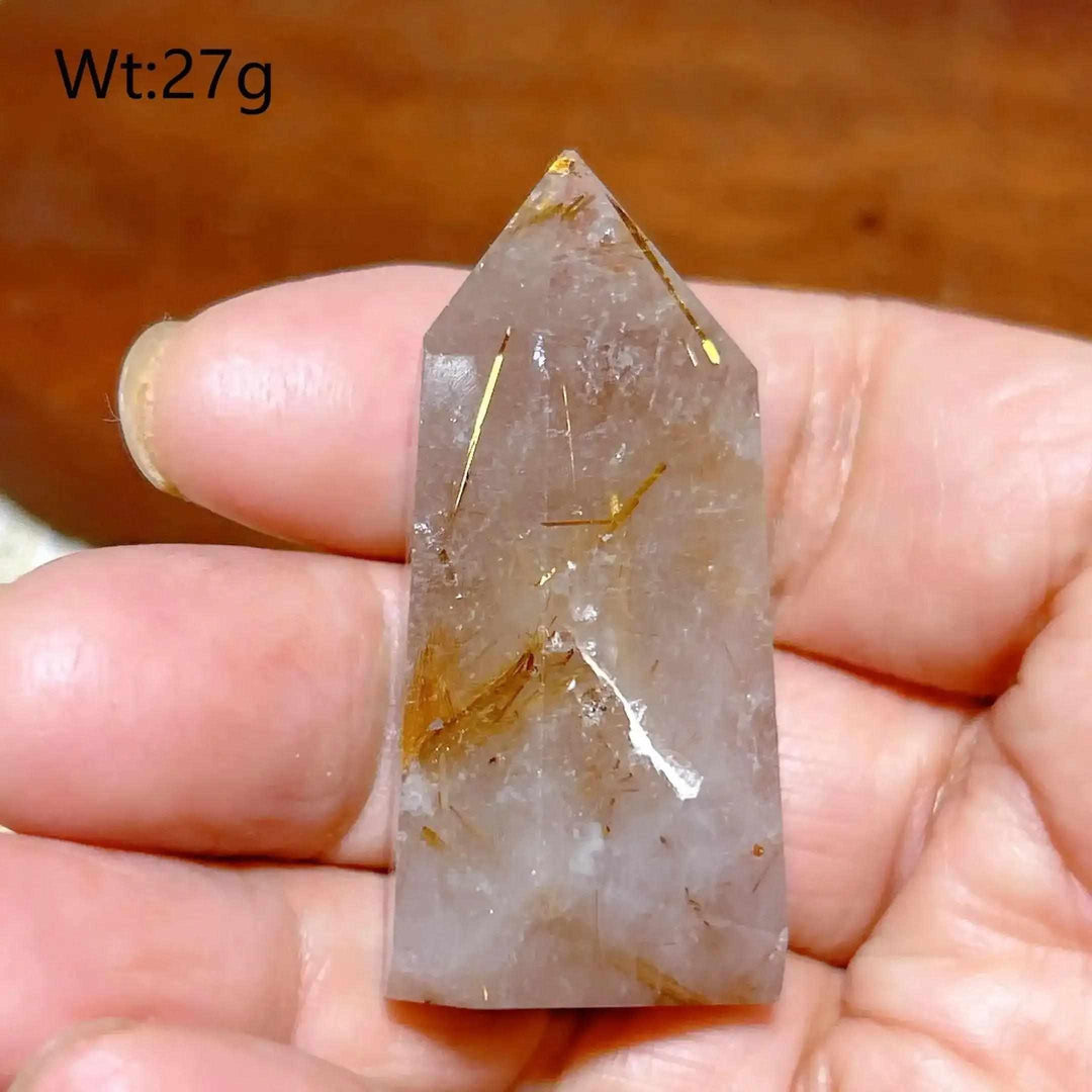 Hand-polished Golden Rutilated Quartz tower with fine golden needles, perfect for focus and energy amplification.