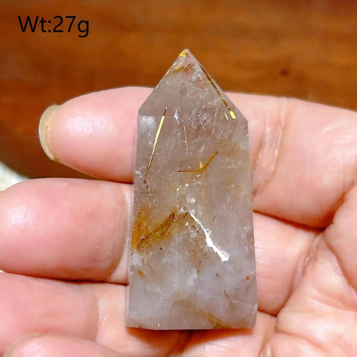 Hand-polished Golden Rutilated Quartz tower with fine golden needles, perfect for focus and energy amplification.