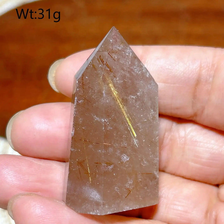 Hand-polished Golden Rutilated Quartz tower featuring fine golden needles for amplified energy and focus.