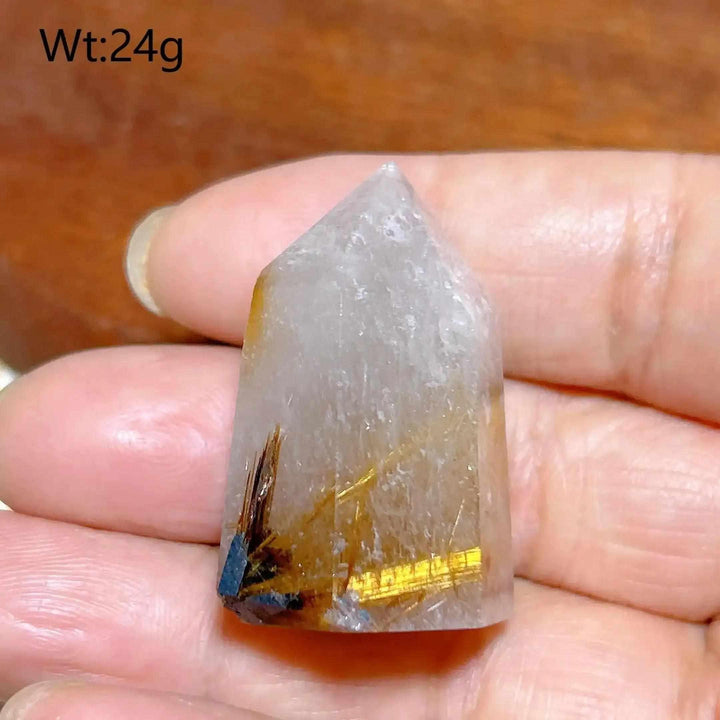 Hand-polished Golden Rutilated Quartz tower with golden rutile needles, perfect for focus and energy amplification.