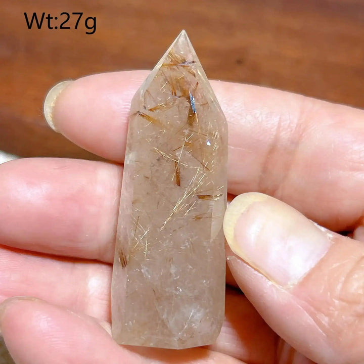 Hand-polished Golden Rutilated Quartz tower with fine golden needles, perfect for focus and energy manifestation.