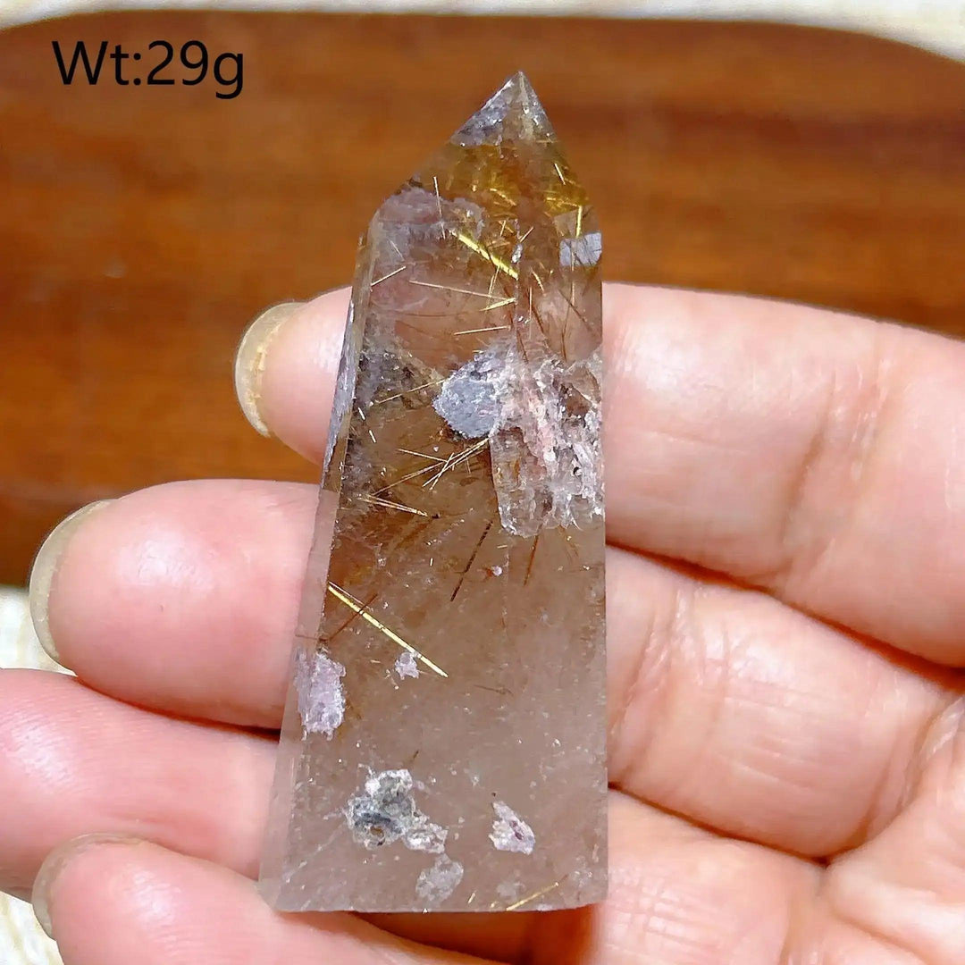 Hand-polished Golden Rutilated Quartz tower with fine golden needles, perfect for meditation and energy amplification.
