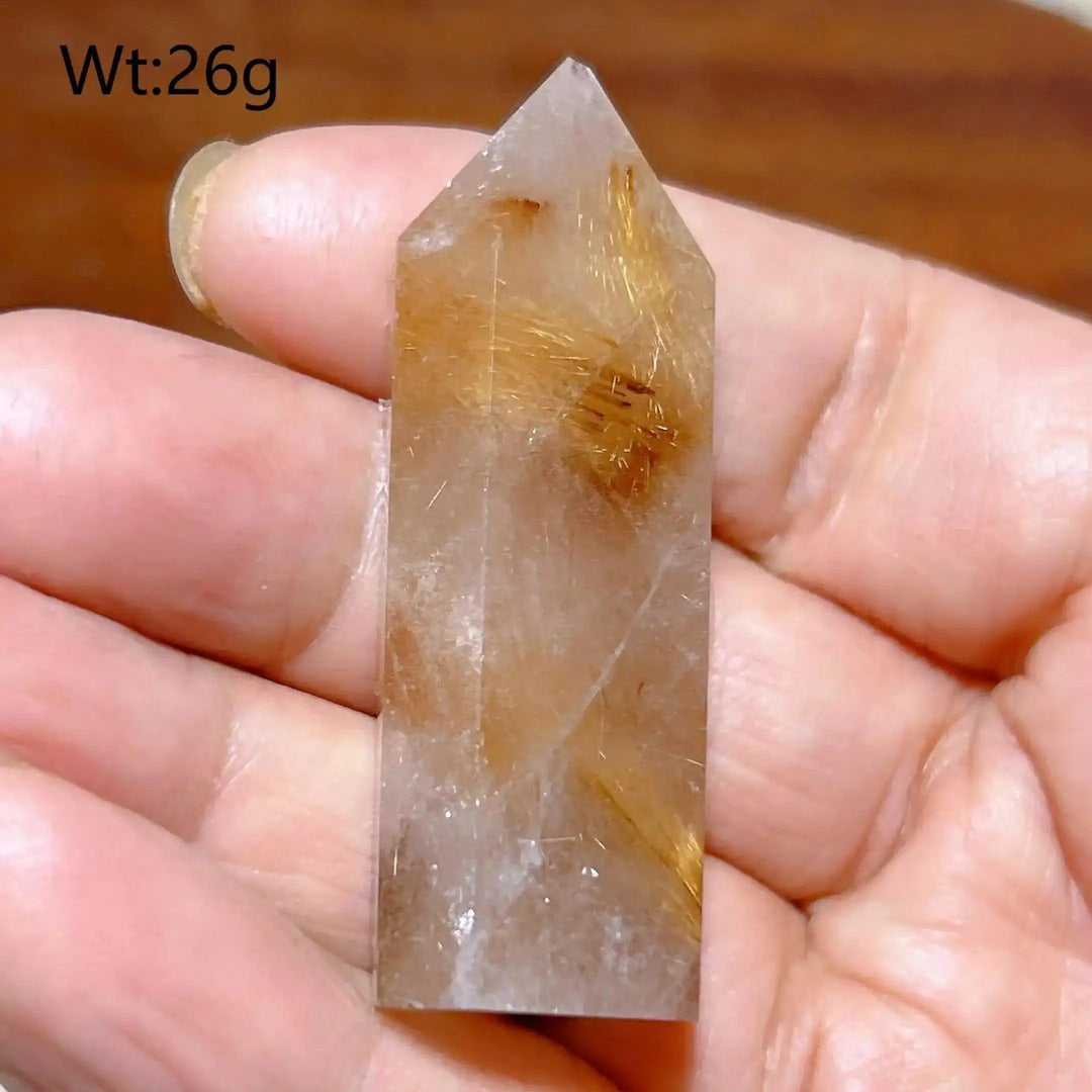 Hand-polished Golden Rutilated Quartz tower with golden needles, perfect for meditation and energy focus.