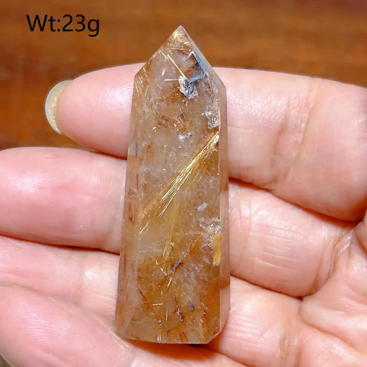 Hand-polished Golden Rutilated Quartz tower with fine golden needles, perfect for focus and energy amplification.