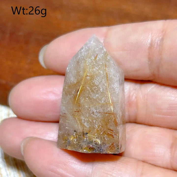 Hand-polished Golden Rutilated Quartz tower with golden needles, perfect for amplifying energy and focus.