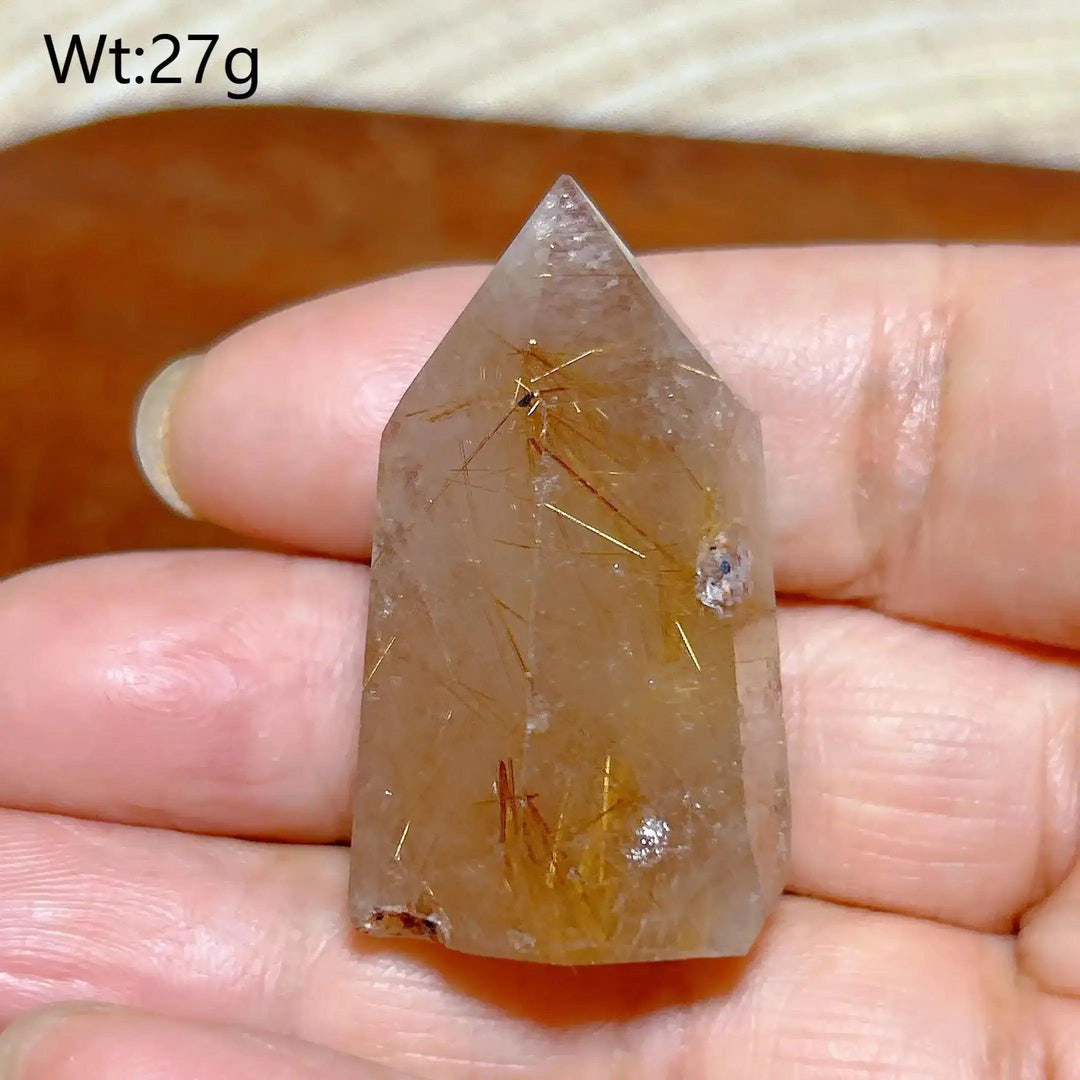 Hand-polished Golden Rutilated Quartz tower with fine golden needles, perfect for focus and energy amplification.