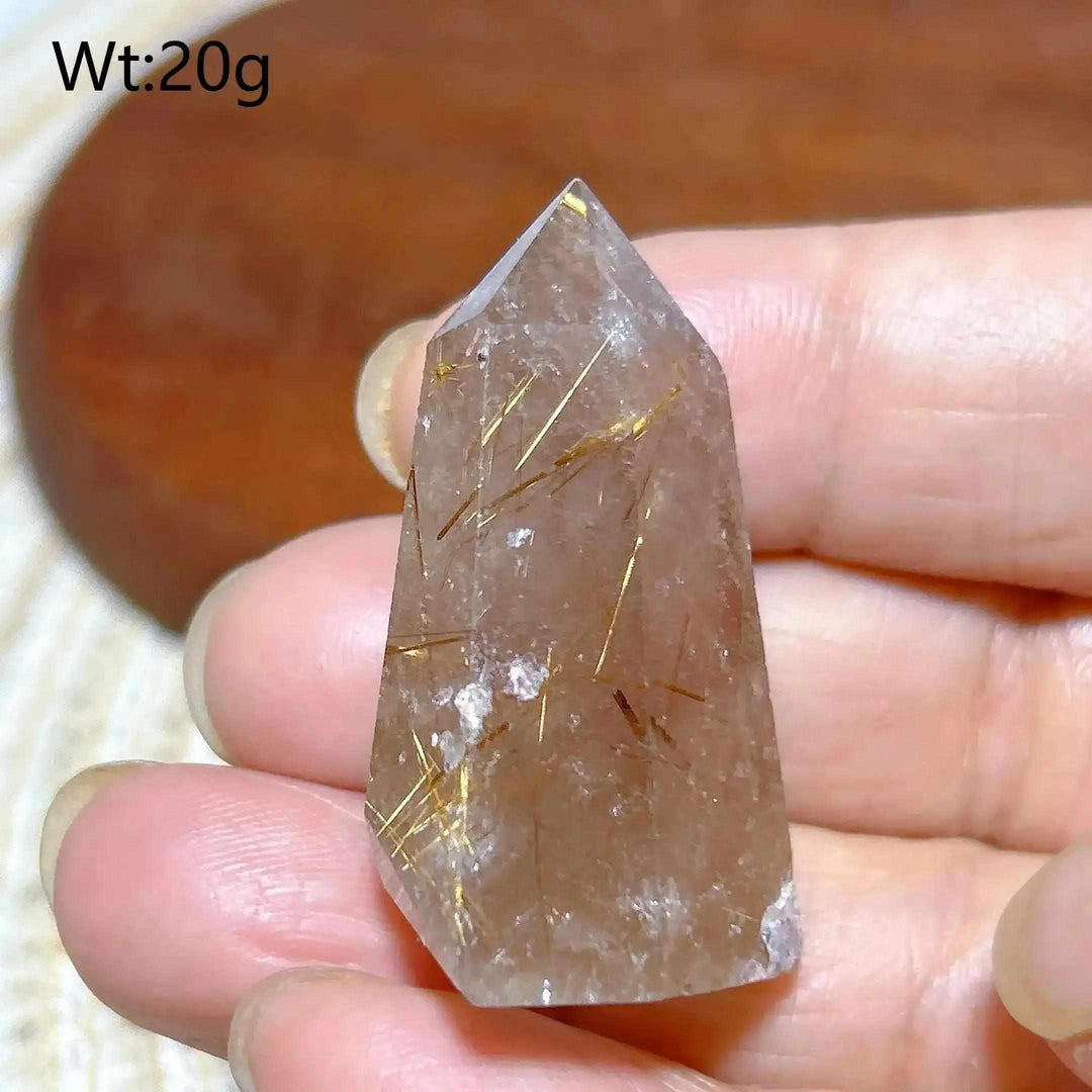 Hand-polished Golden Rutilated Quartz tower with fine golden needles for focused energy and manifestation.