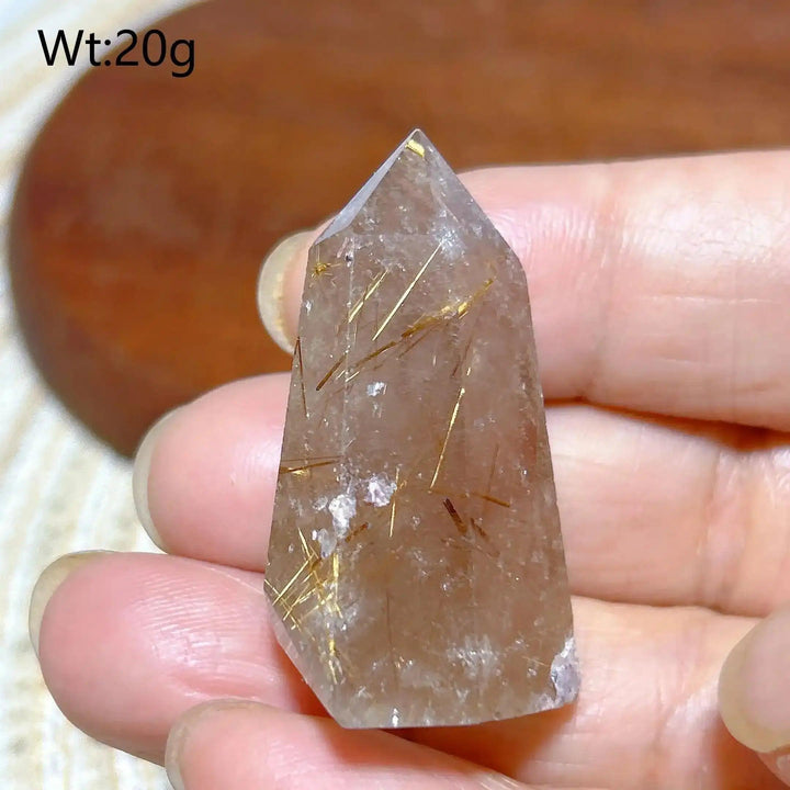 Hand-polished Golden Rutilated Quartz tower with fine golden needles for focused energy and manifestation.
