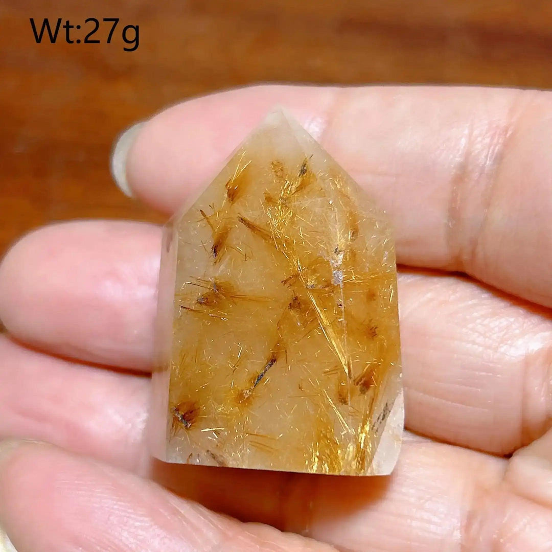 Hand-polished Golden Rutilated Quartz tower with fine golden needles, perfect for focus and energy amplification.