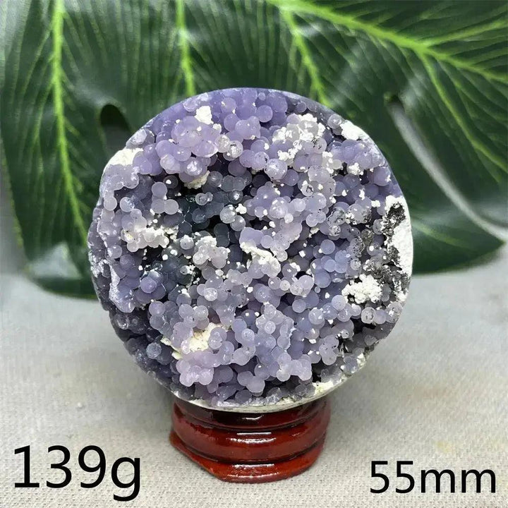 Indonesian Grape Agate Crystal Sphere with rare botryoidal lilac and deep purple nodules, 139g, 55mm, on wood stand.