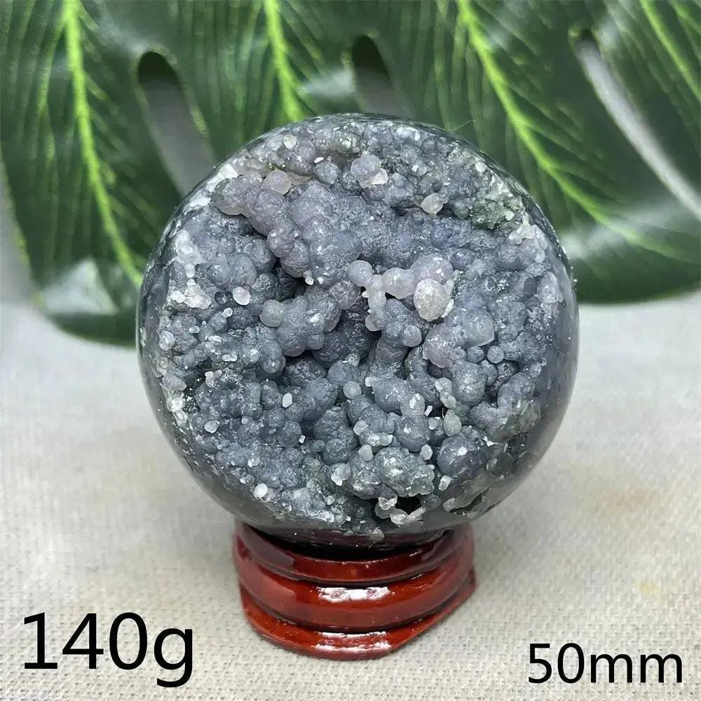 Indonesian Grape Agate Crystal Sphere: Polished orb with shimmering lilac, lavender, deep purple botryoidal formations on a stand.