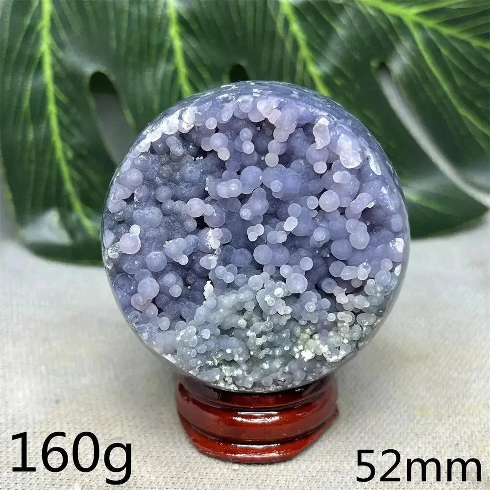 Indonesian Grape Agate Crystal Sphere, 160g, 52mm. Lilac, lavender, deep purple botryoidal formations on a wooden stand.