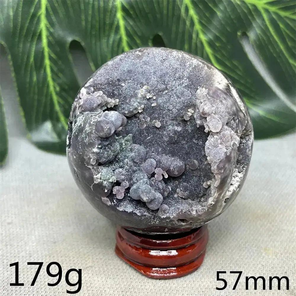 Indonesian Grape Agate Crystal Sphere, 57mm, 179g. Polished orb with shimmering lilac, lavender, deep purple botryoidal formations. Soothing energy.