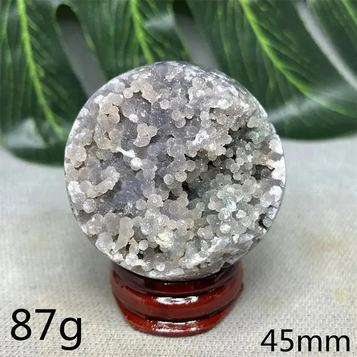 Indonesian Grape Agate Crystal Sphere: Lilac, lavender, and deep purple botryoidal formations, 87g, 45mm, on wood stand.