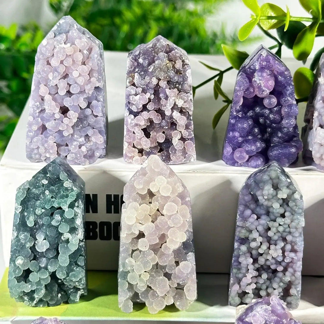 Grape Agate Towers from Crystal Destiny, featuring unique botryoidal formations in purple, lavender, and green hues.