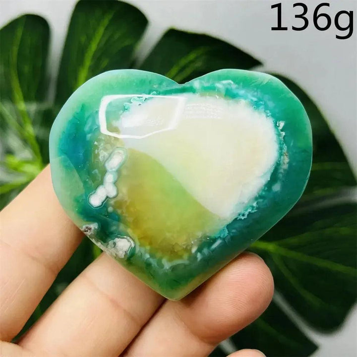 Green Agate Crystal Heart: Hand-carved heart with natural green banding, translucent beauty, and nurturing energy.