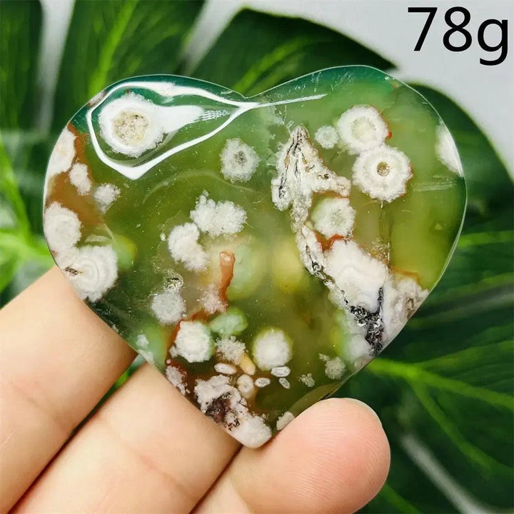 Green Agate Crystal Heart: Hand-carved, translucent green agate heart with white flower-like inclusions, 78g.
