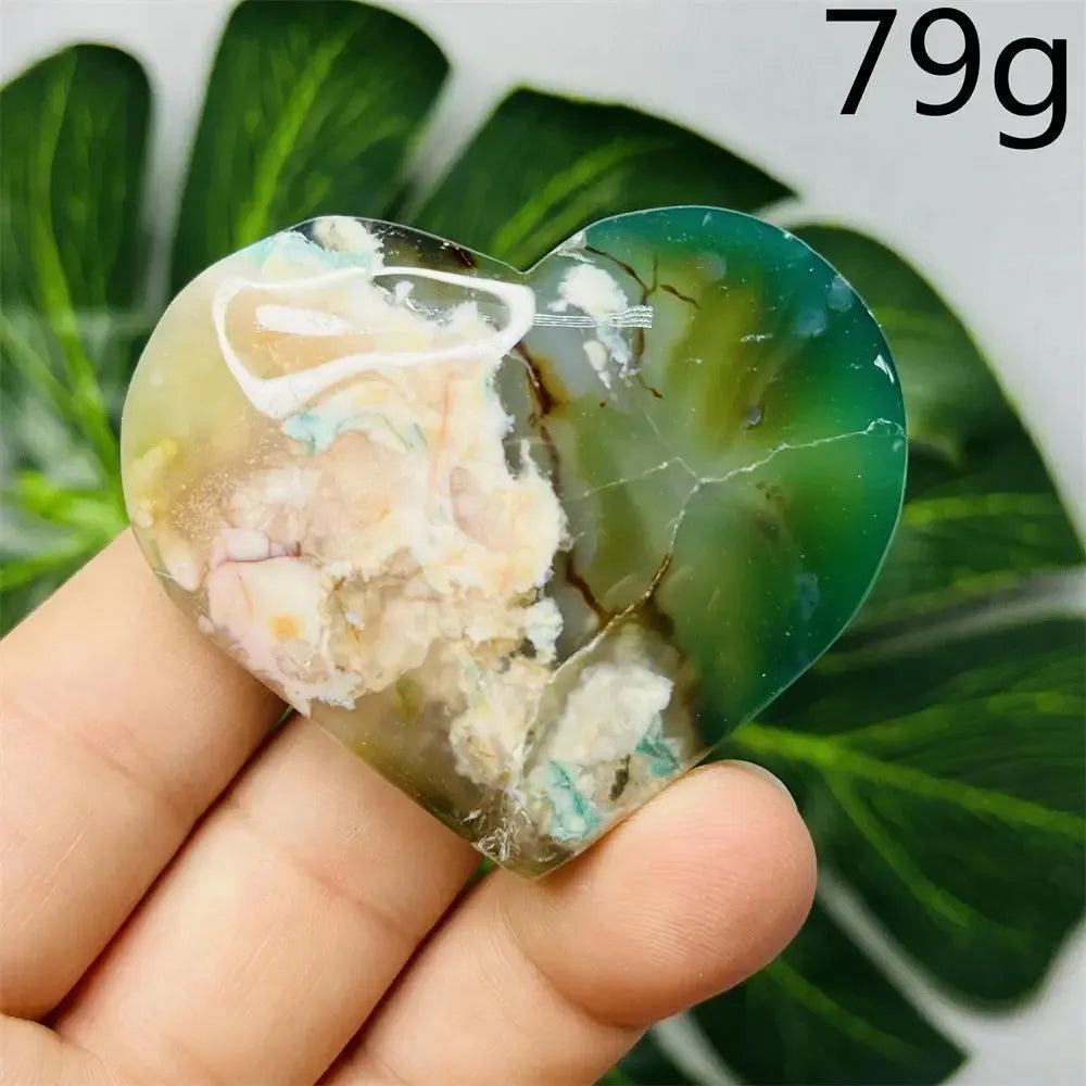 Green Agate Crystal Heart, hand-carved with flower design, showcasing natural green banding and translucent beauty.