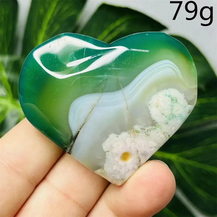 Green Agate Crystal Heart: Hand-carved, translucent heart with vibrant green, white, and subtle yellow banding, weighing 79g.