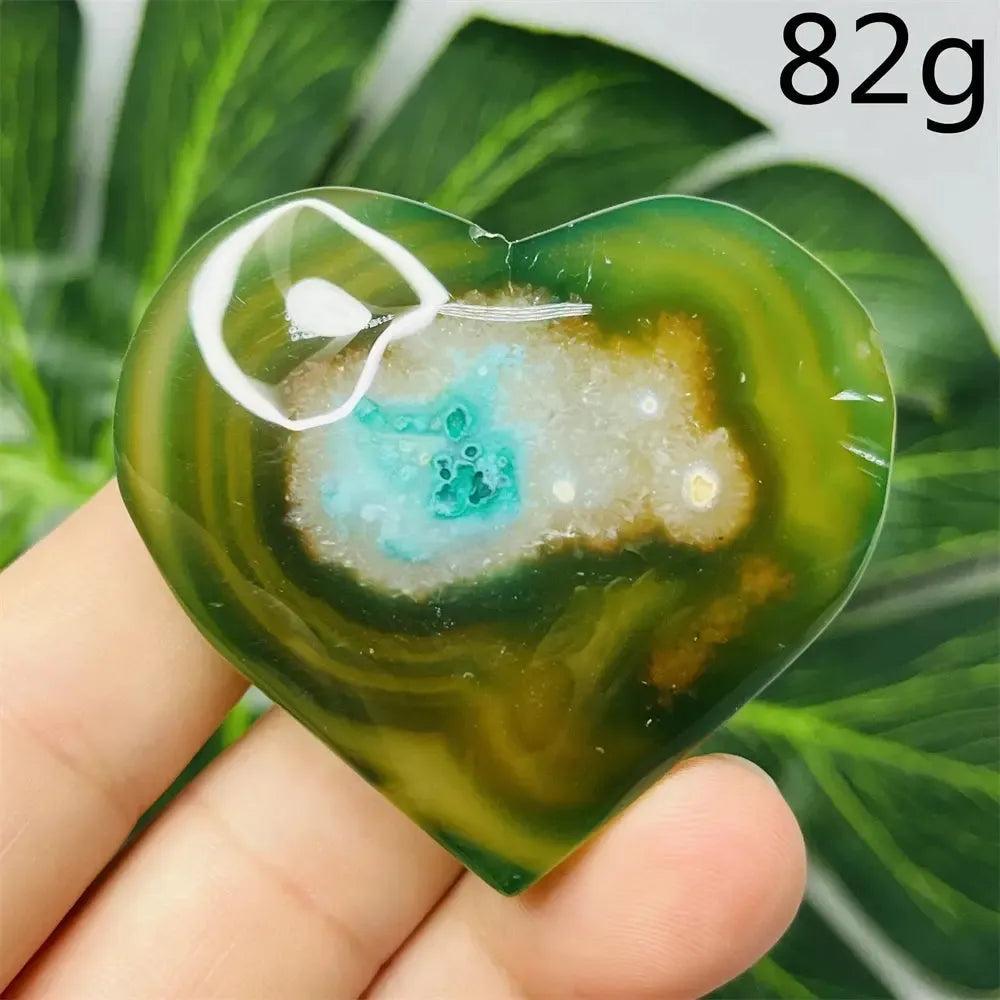 Green Agate Crystal Heart, hand-carved with natural green banding, translucent beauty, and nurturing energy for emotional balance.