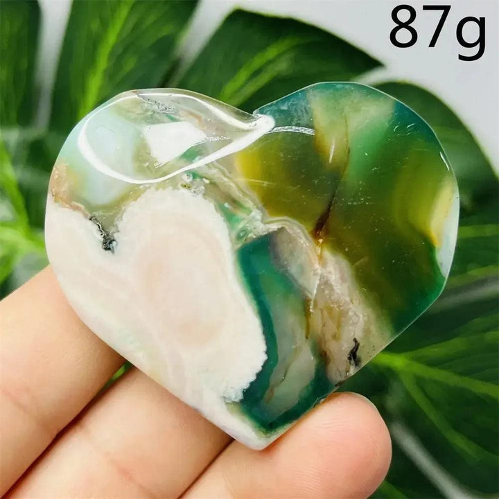 Green Agate Crystal Heart, hand-carved with natural green banding, white, and brown hues, weighing 87g.