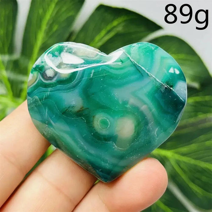 Green Agate Crystal Heart, hand-carved with unique green banding, promoting growth, abundance, and emotional balance.
