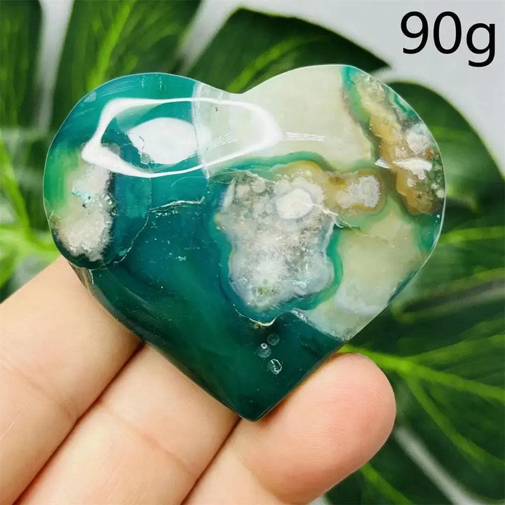 Green Agate Crystal Heart: Hand-carved, polished heart with vibrant green banding, white, and brown inclusions, 90g.