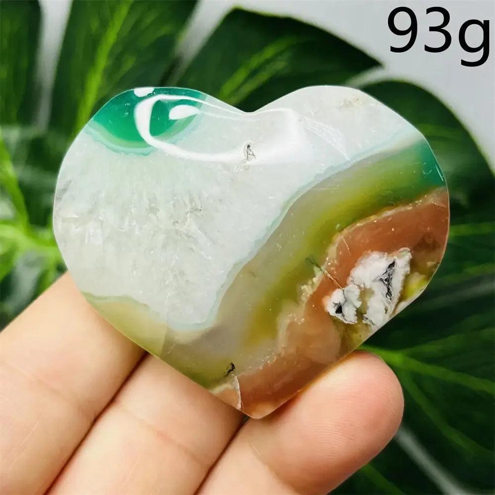 Hand-carved Green Agate Crystal Heart, 93g, with natural green, white, and brown banding, promoting growth and emotional balance.