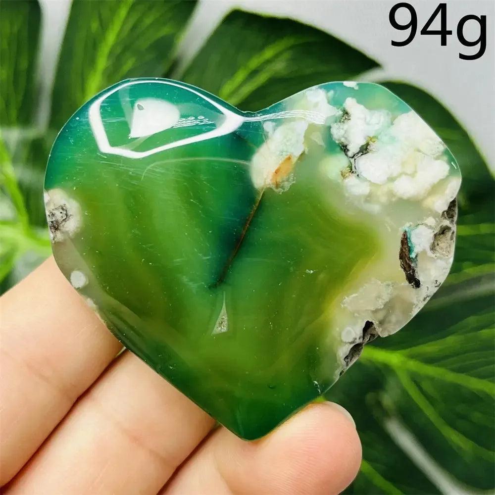 Green Agate Crystal Heart: Hand-carved, vibrant green agate heart with natural banding and white inclusions, 94g.