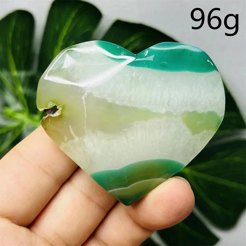 Green Agate Crystal Heart: Hand-carved, polished heart with natural green and white banding, promoting growth and emotional balance.