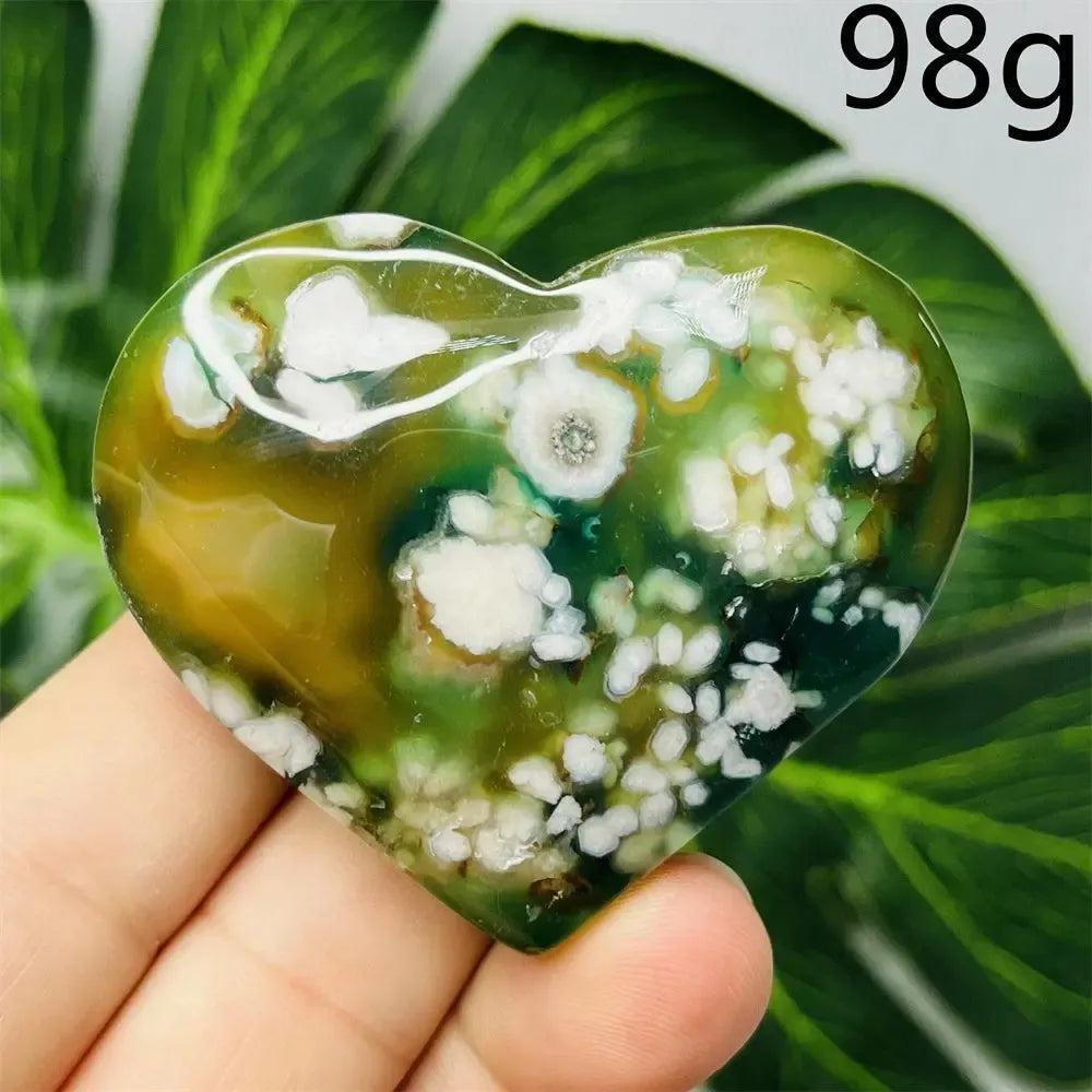Hand-carved Green Agate Crystal Heart with unique green banding and translucent beauty, promoting emotional balance.