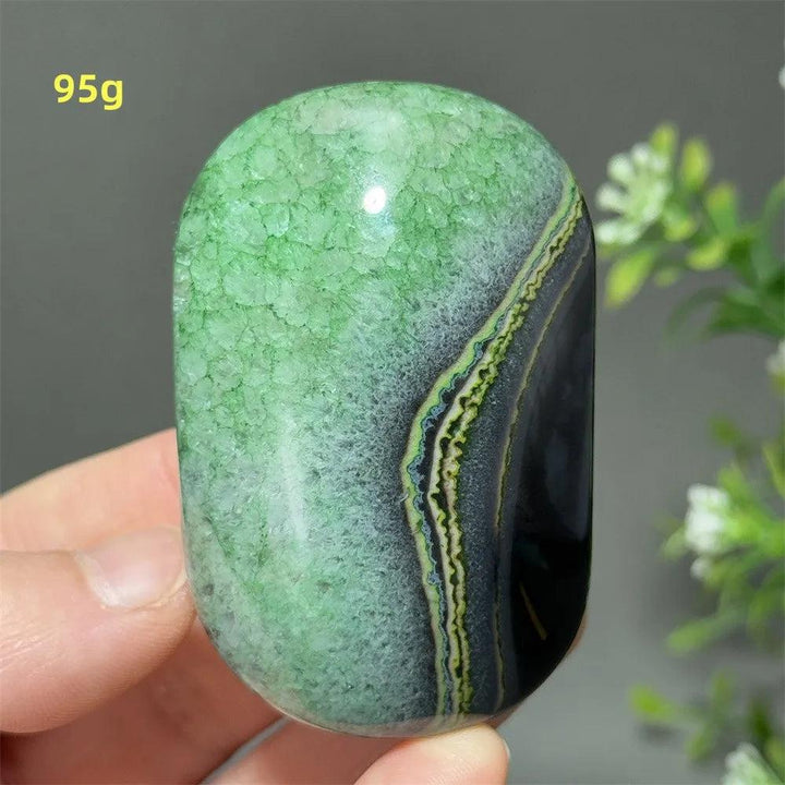 95g natural green agate palm stone with vibrant banded patterns, perfect for healing, meditation, and spiritual energy.