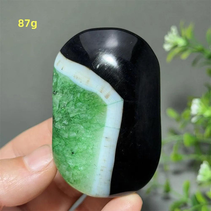 87g natural green agate palm stone with striking black and white banding, perfect for healing and spiritual meditation.