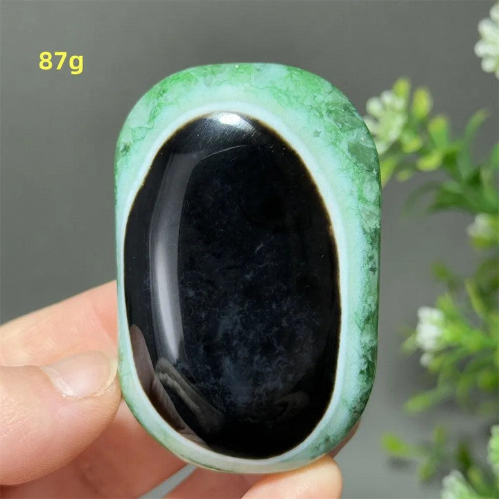 87g natural green agate palm stone with a polished black center, perfect for reiki healing and spiritual meditation.