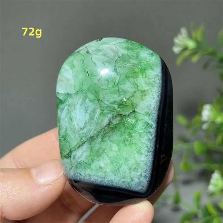 Polished 72g natural green agate palm stone for meditation, featuring vibrant green patterns and grounding black base.