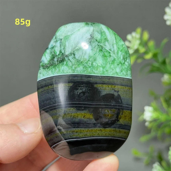 Polished 85g natural green agate palm stone with unique banded patterns, perfect for reiki, meditation, and healing.
