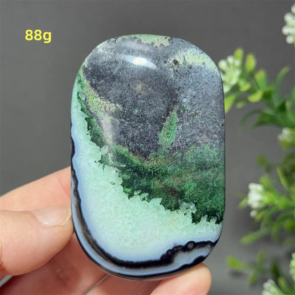 Polished 88g natural green agate palm stone for meditation, featuring unique mossy patterns and healing energy.