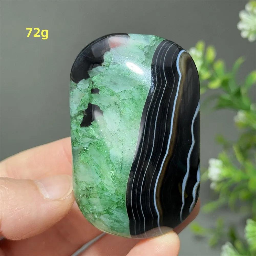 Polished 72g natural green agate palm stone with striking black banded patterns for meditation and spiritual healing.