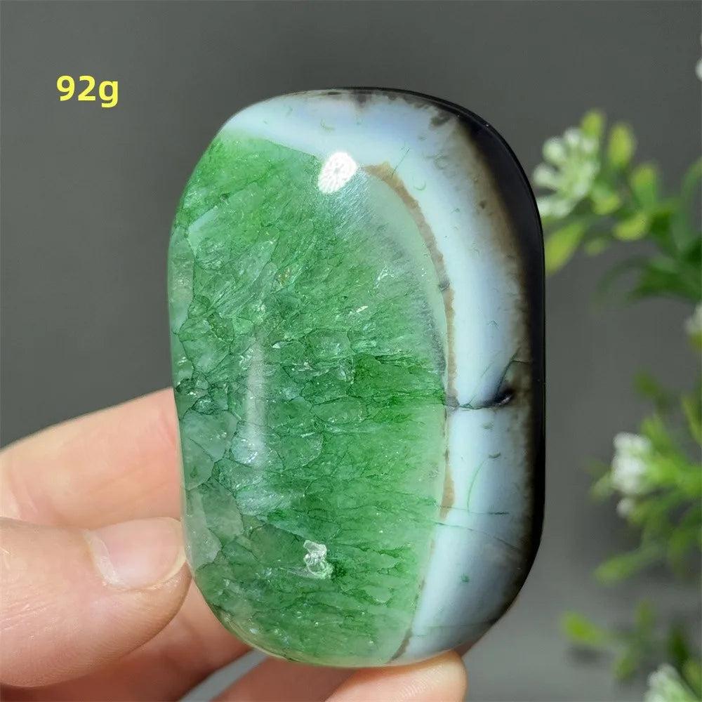 Polished 92g natural green agate palm stone, perfect for healing, meditation, and spiritual energy balancing.