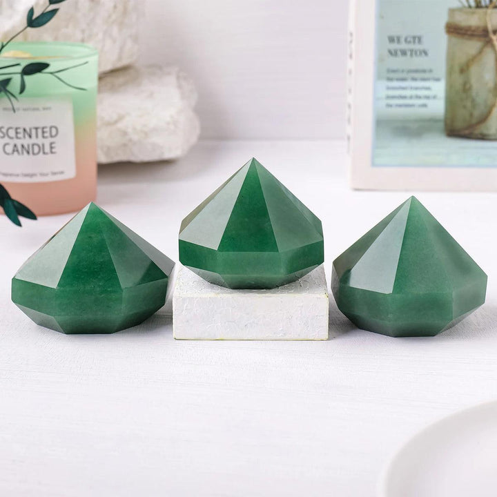 Three polished green aventurine quartz crystal pyramids for Reiki healing, meditation, and decorative balancing.