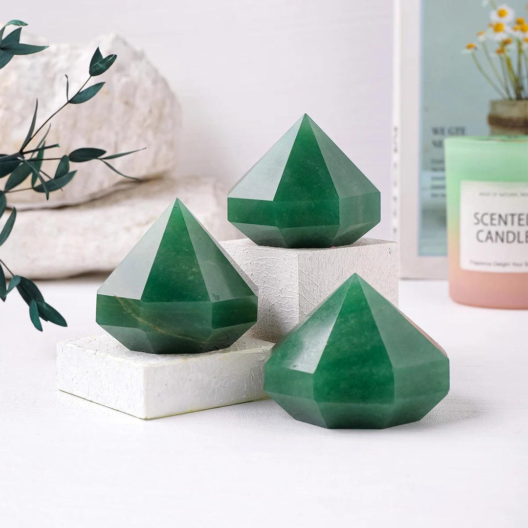 Three polished green aventurine quartz crystal pyramids for Reiki healing, meditation, and decorative Feng Shui balancing.