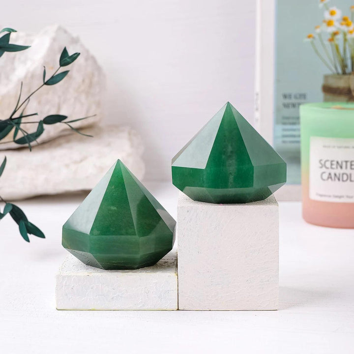 Polished green aventurine quartz crystal pyramids for Reiki healing, meditation, and elegant Feng Shui home decor.