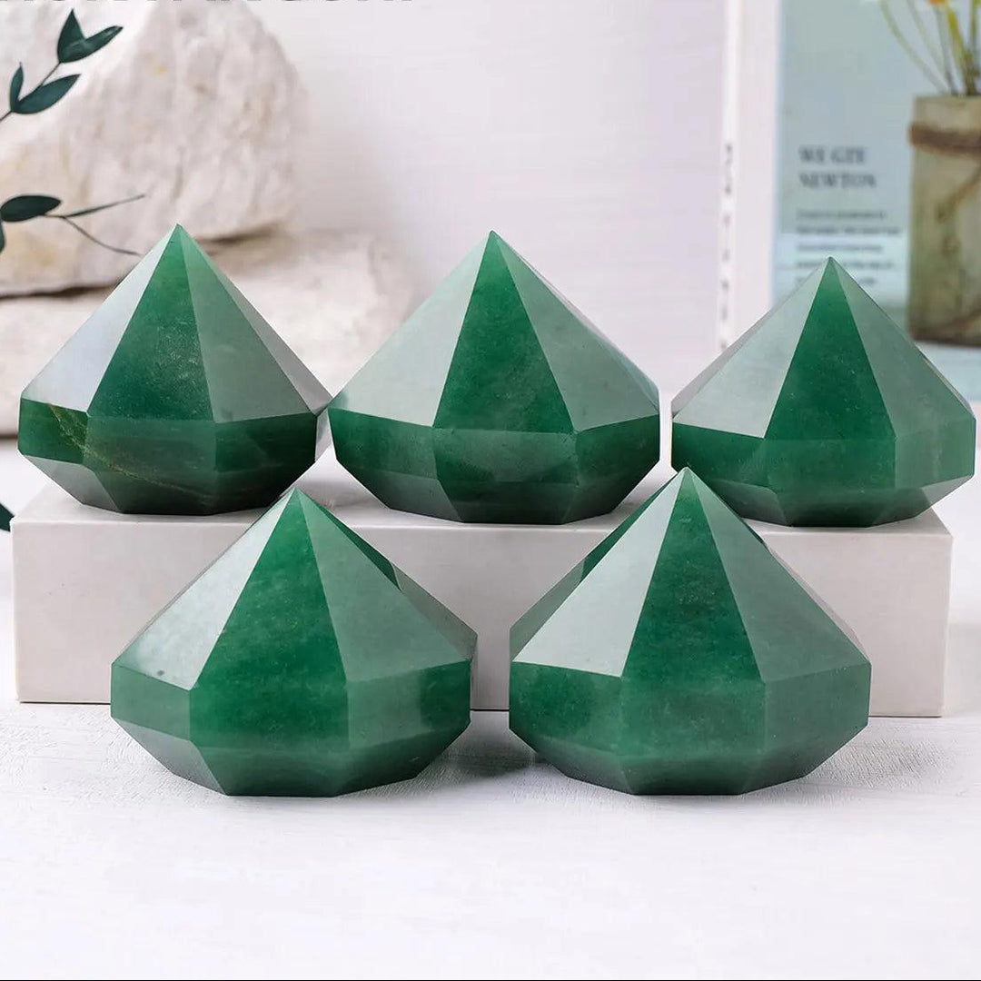 Five polished green aventurine quartz crystal pyramids for Reiki healing, meditation, and Feng Shui home decor.