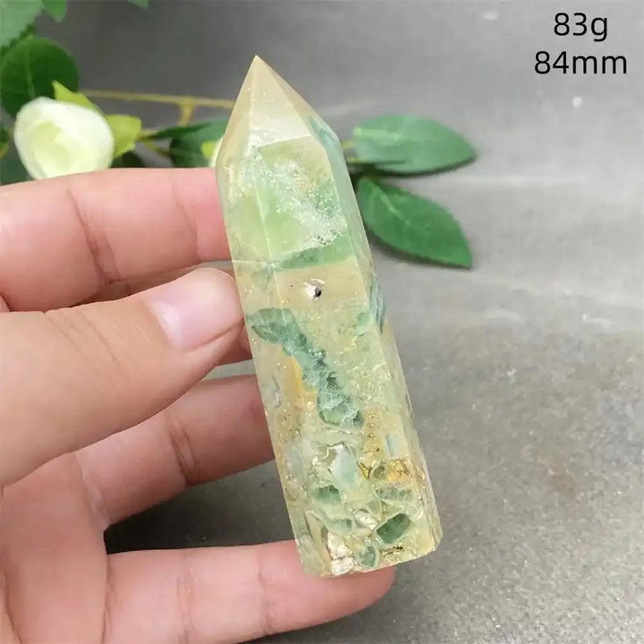 Hand-polished green calcite tower with natural banding and a faceted point for Heart chakra healing and emotional balance.