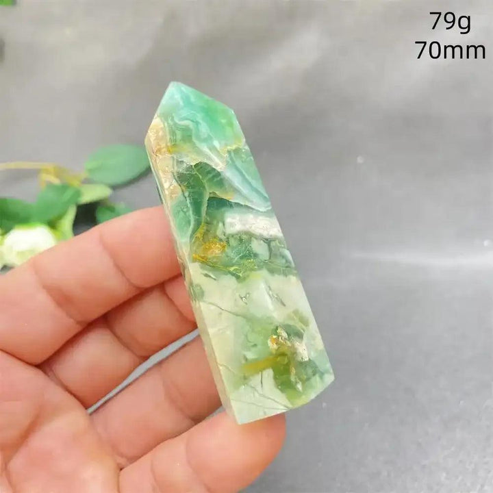 Hand-polished Green Calcite tower with natural green banding and a faceted point for Heart chakra healing and renewal.
